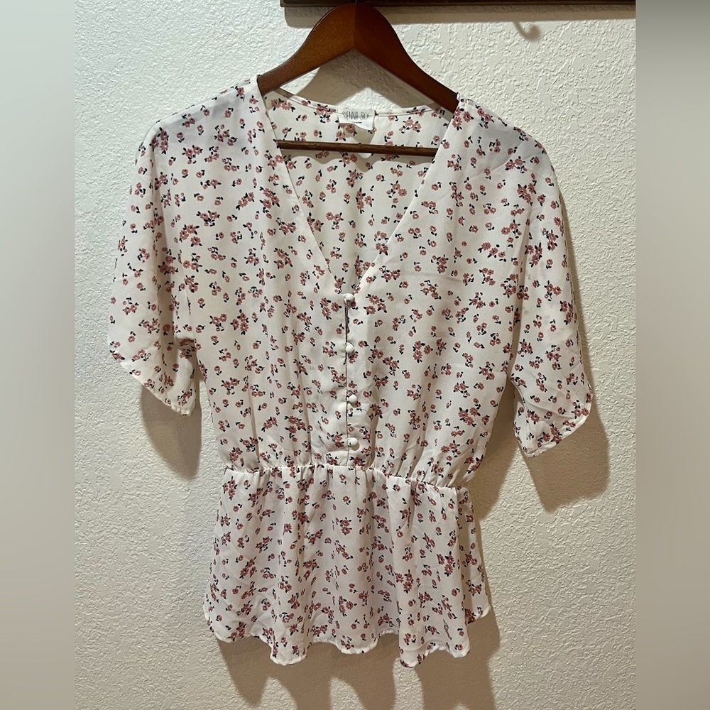 White blouse with pink flowers